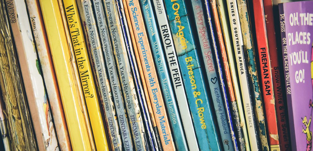 children's books lined up on a shelf