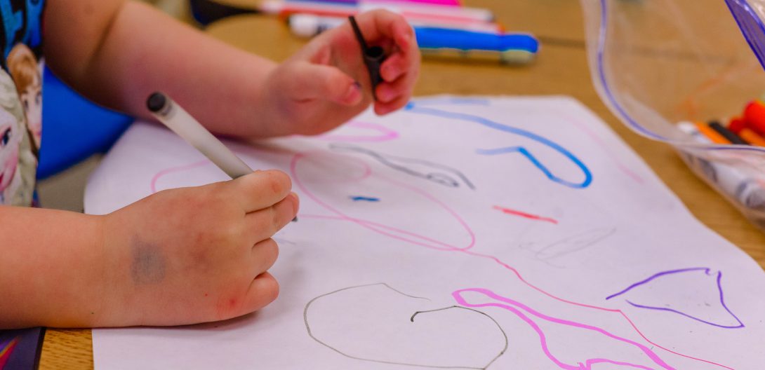 a child drawing shapes