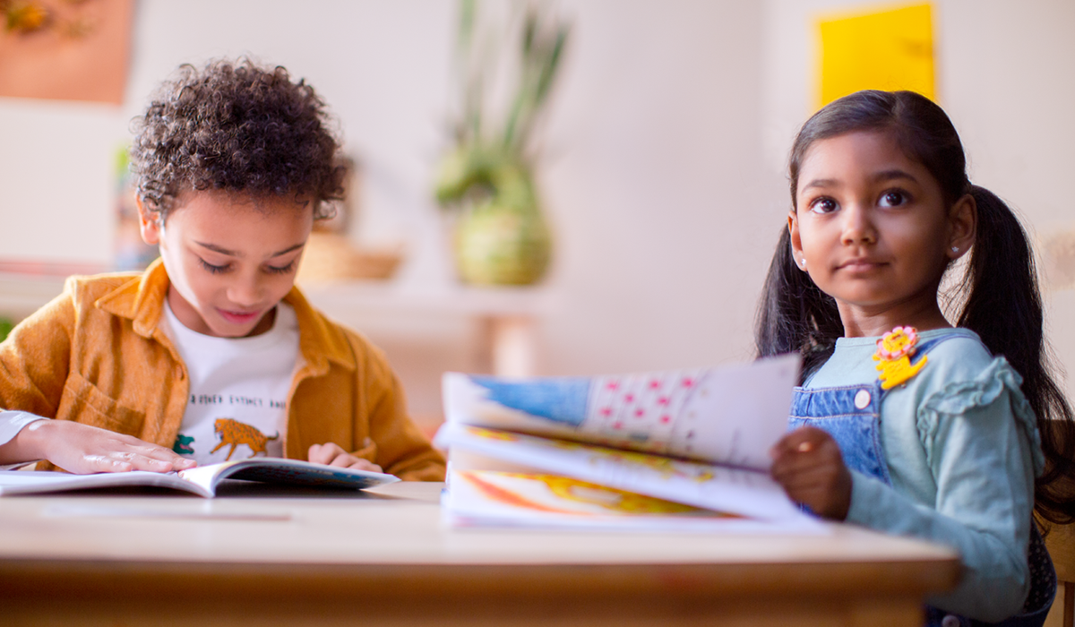 two kids learning to read together