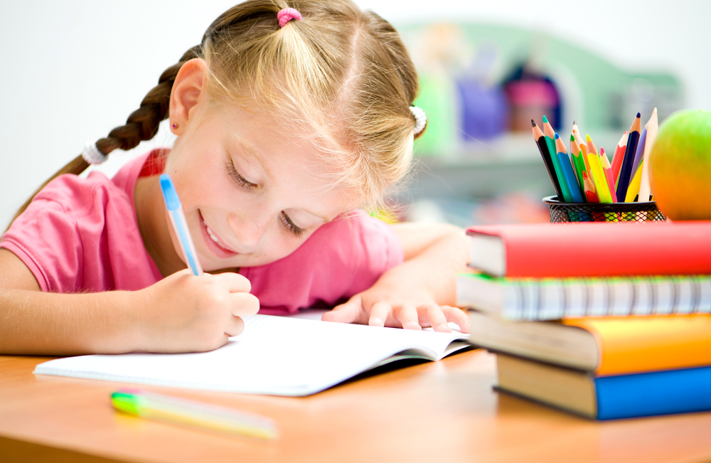 kid coloring and enjoying fun ways to teach reading 