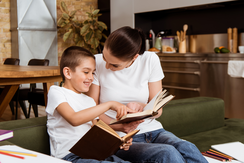 Mom helping son with pre-reading strategies