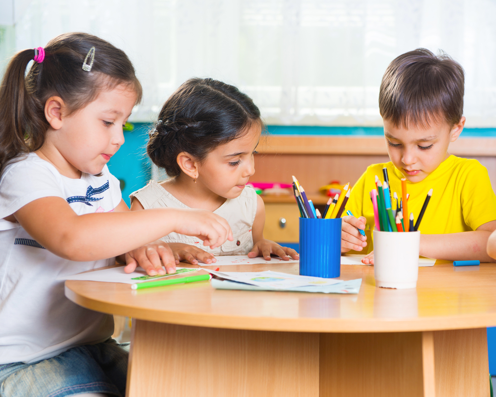 Group of cute little kids doing kindergarten math