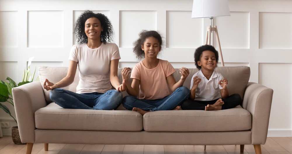Family sitting on couch learning calming strategies for kids