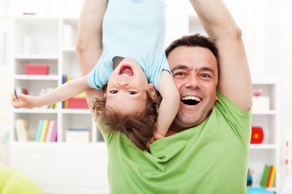 Dad having fun with kid while playing activities for 3-year-olds