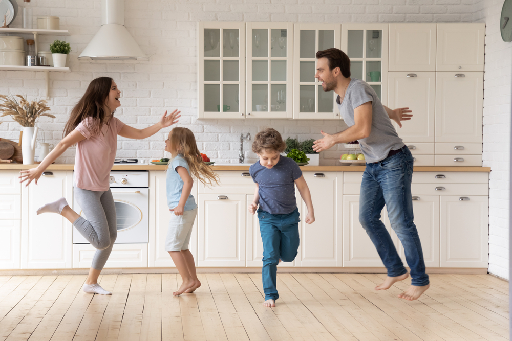 Parents with children dancing while taking brain breaks