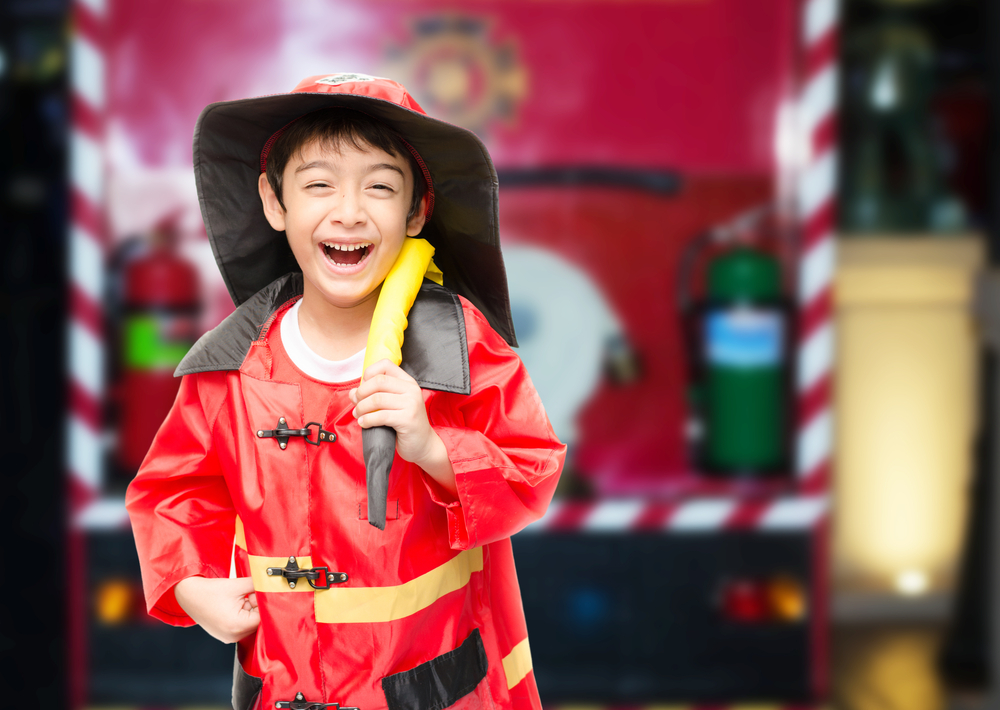 Young boy playing firefighter