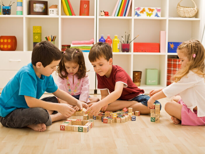 Children learning through play with blocks