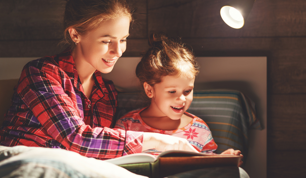 Mom reading to daughter to help with vocabulary 