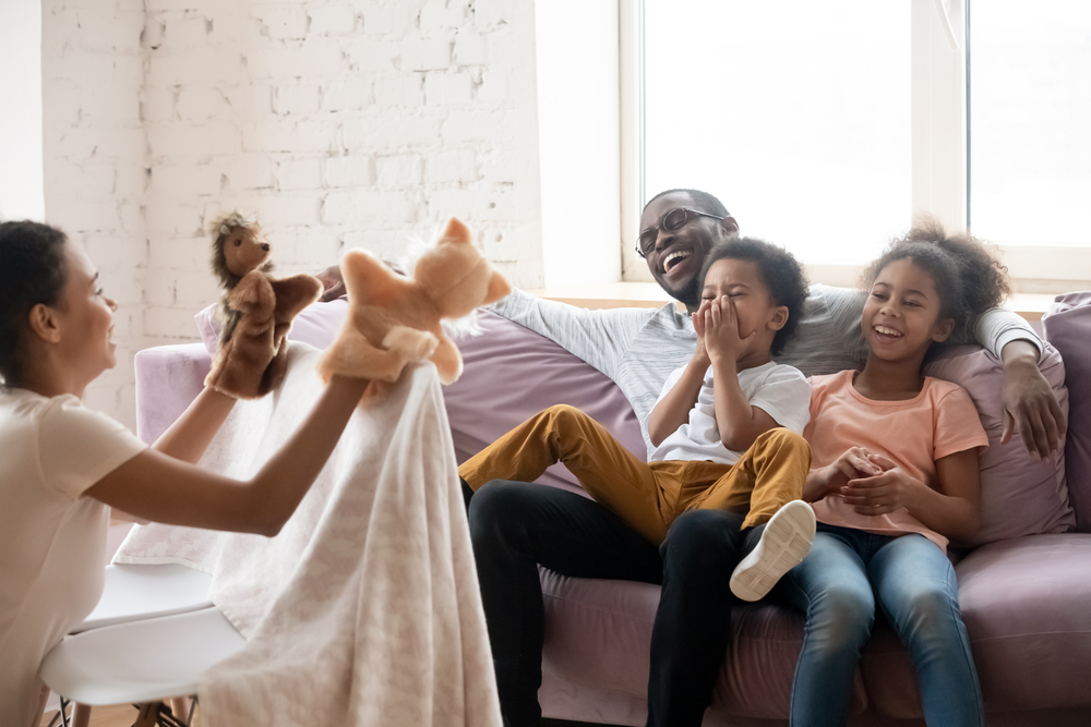 Family doing a puppet show as a  vocabulary strategies