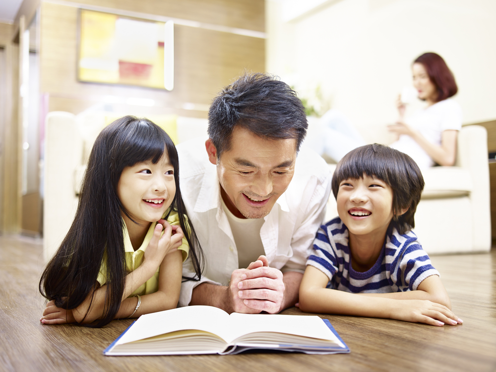 Dad reading with his kids