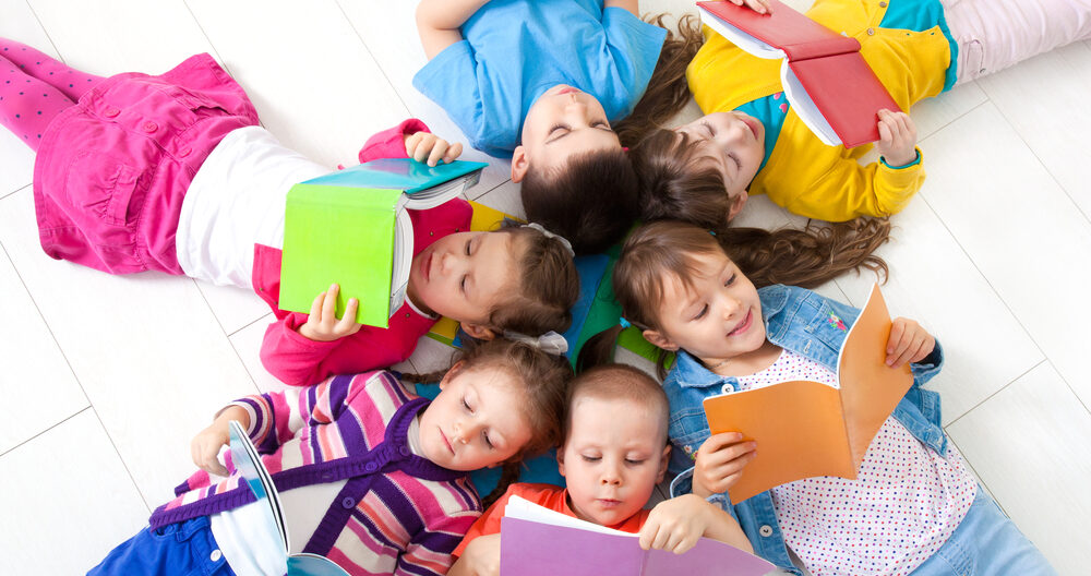 Group of children enjoying reading together