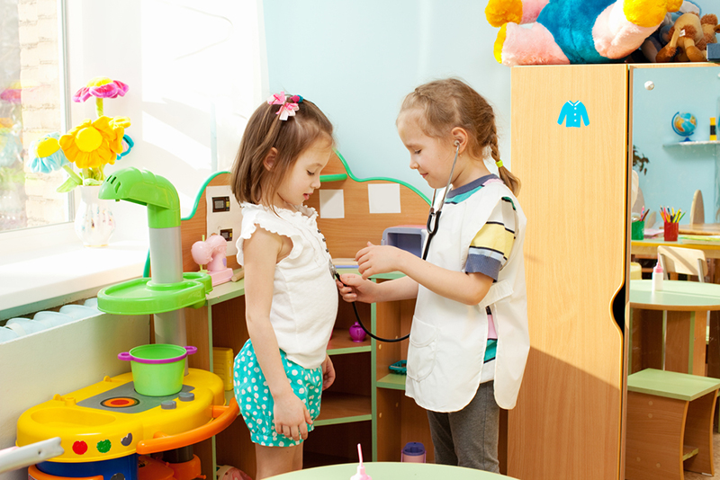 two kids playing in school