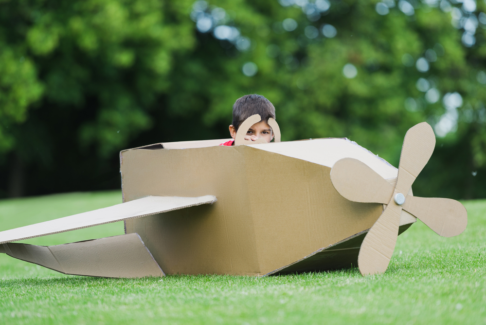 Pretend play with a cardboard box