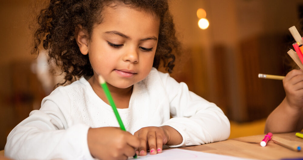 Young girl doing her kindergarten readiness checklist