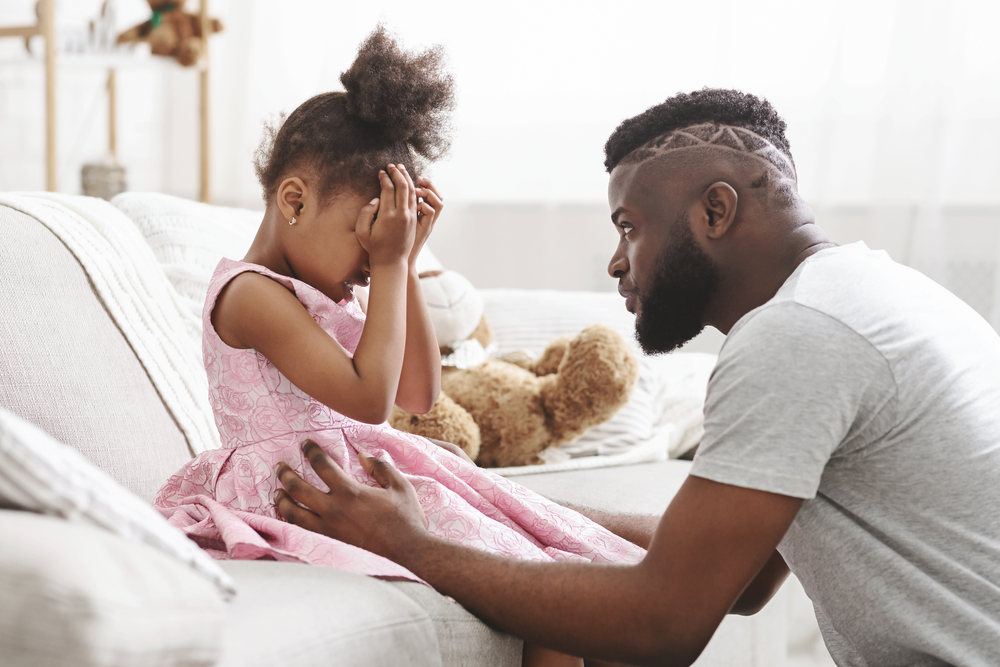 Dad teaching daughter a lesson through kindness activities for kids
