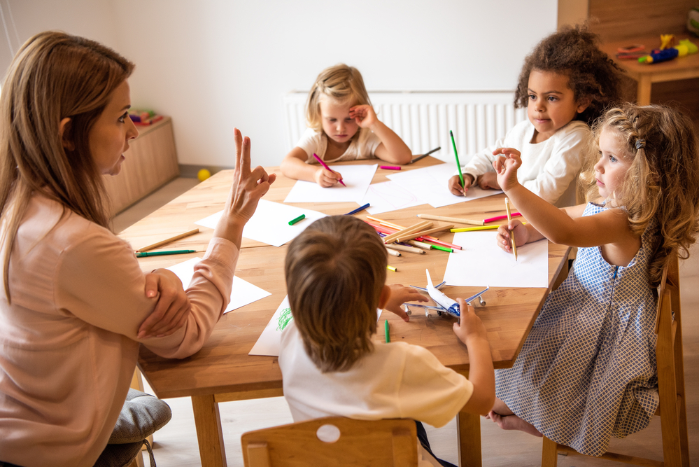 Teacher doing math activities for preschoolers