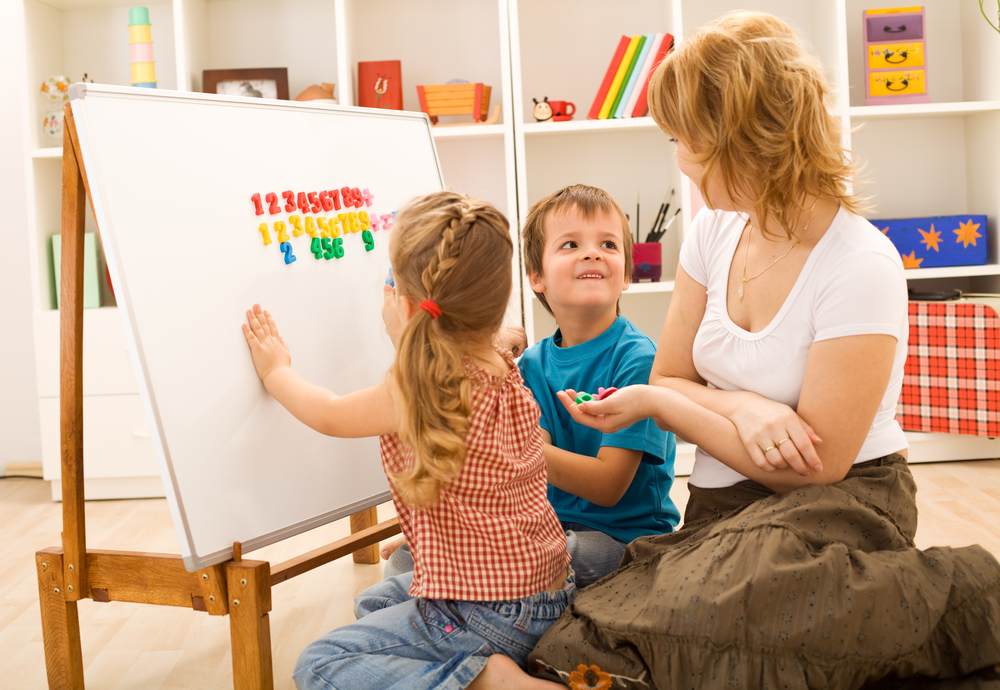 Mom teaching math activities for preschoolers to her kids