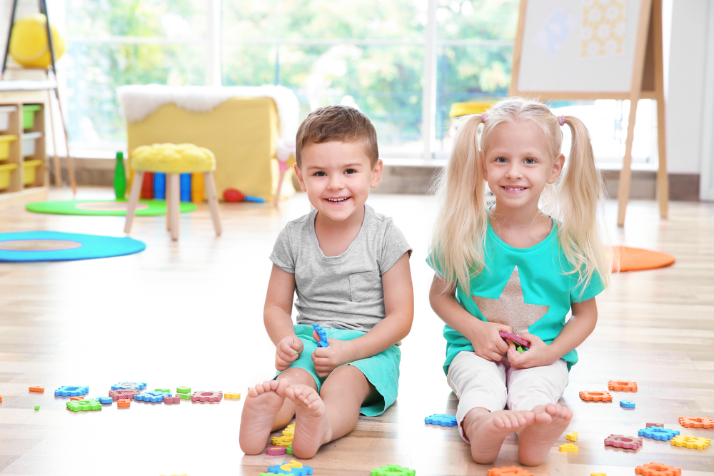 Cute little children playing preschool math games