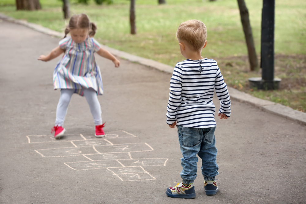 Preschoolers playing hopscotch