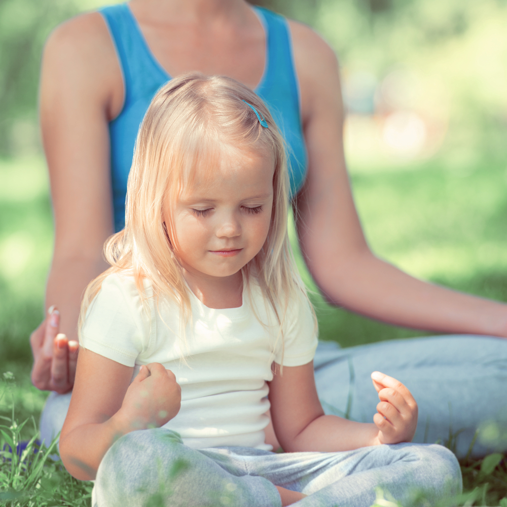 Mom teaching young girl mindfulness for kids