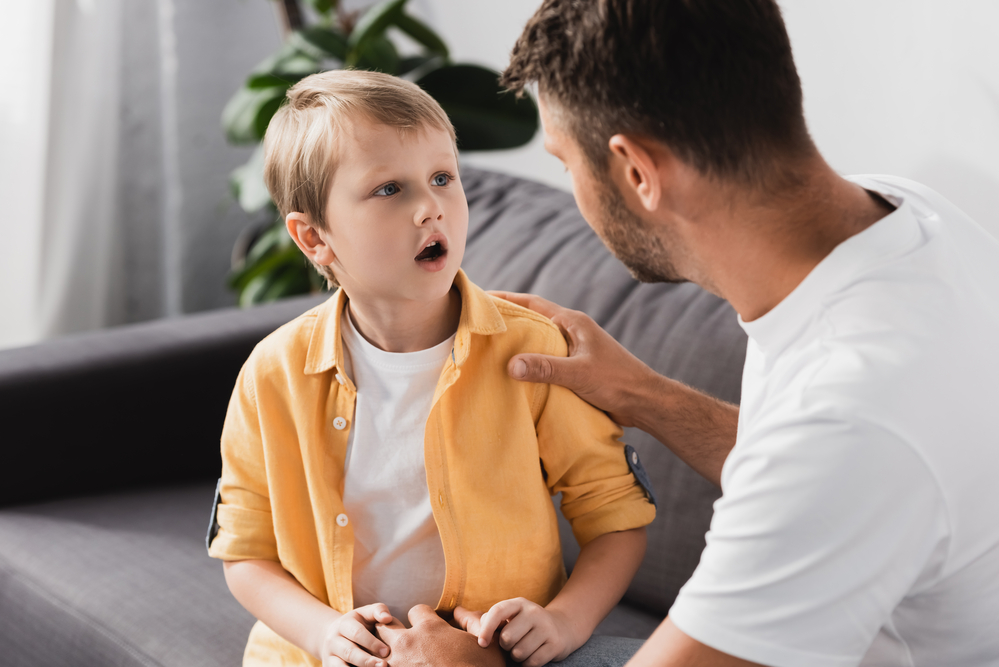 Dad talking with son about emotions for kids