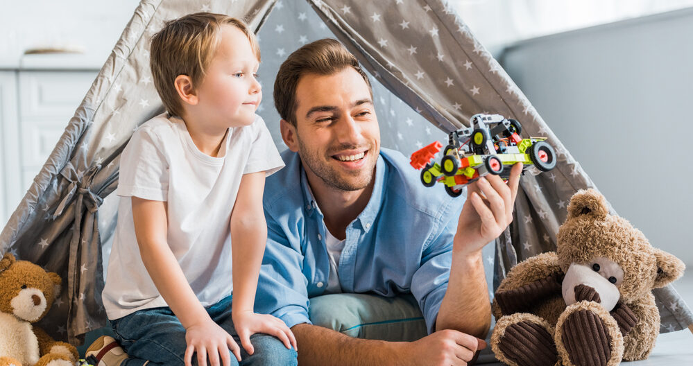 Dad playing fun educational games with son