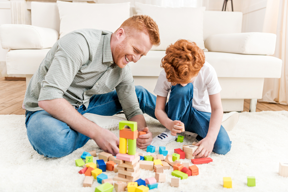 Dad playing fun educational games with son