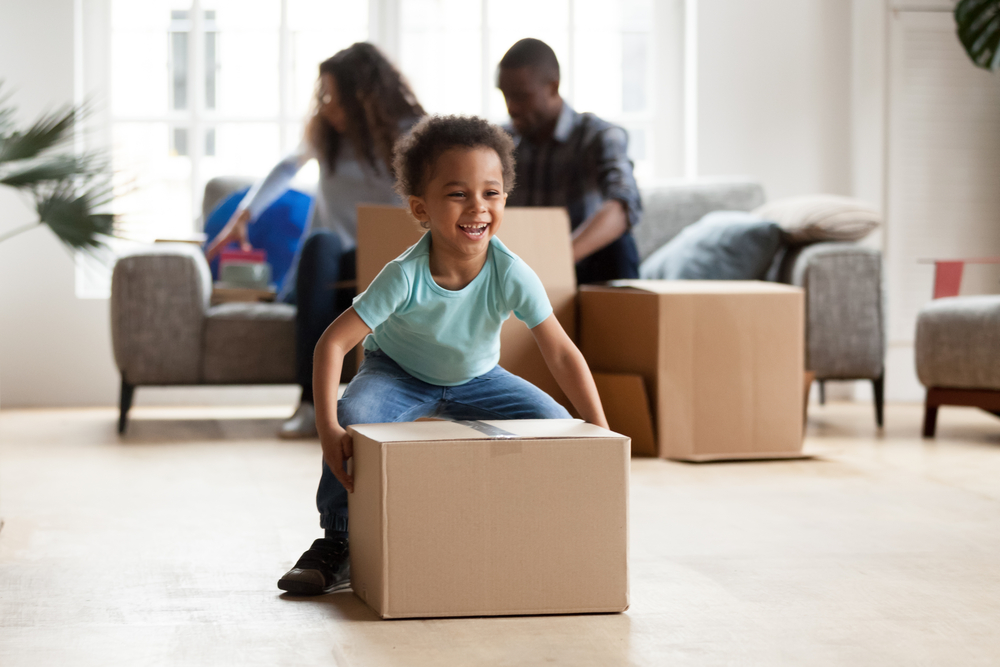 Kid having fun with a box