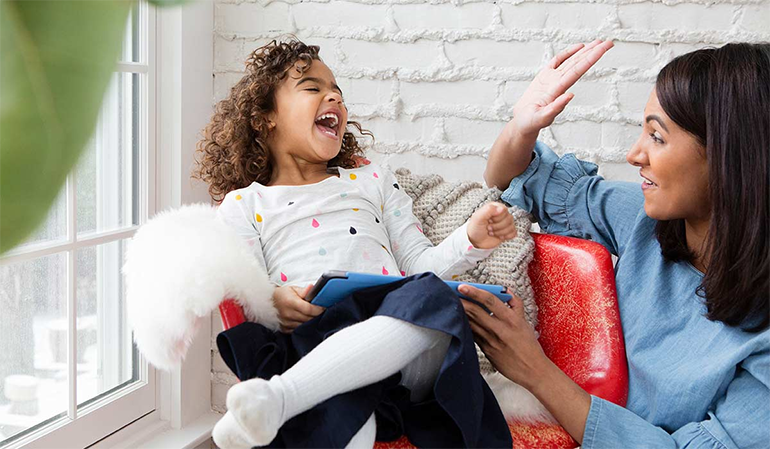 Mom and daughter working on reading fluency