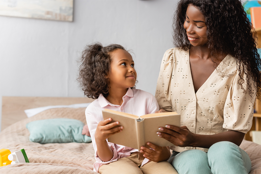 Mom reading to daughter