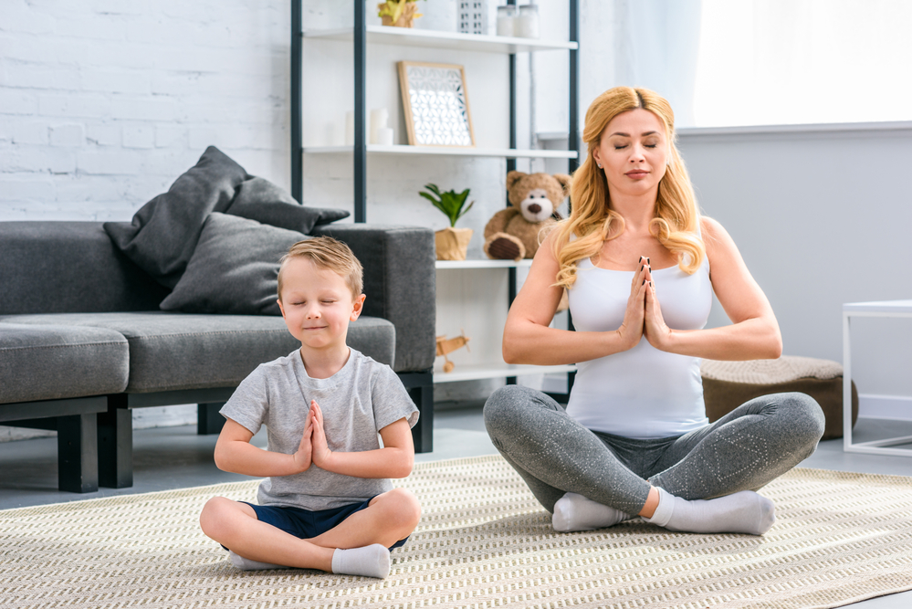 Mom teaching meditation to son