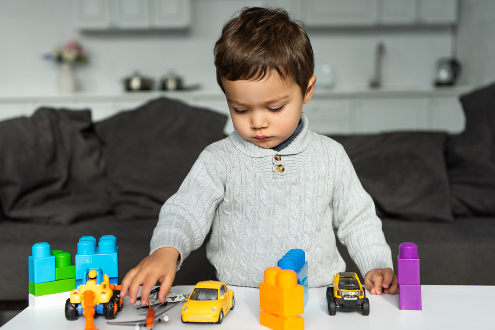 Young boy playing with toys