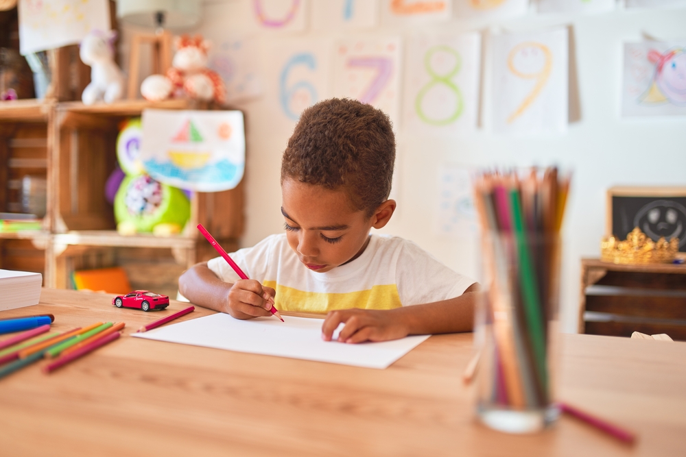 Young boy coloring 