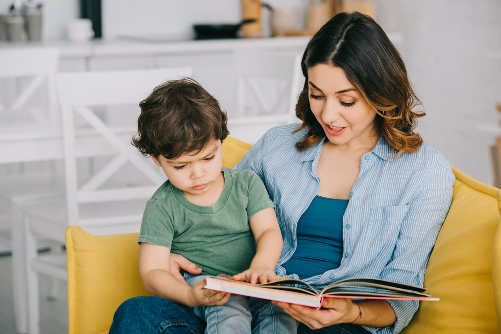 Mom reading to son to teach segmenting words