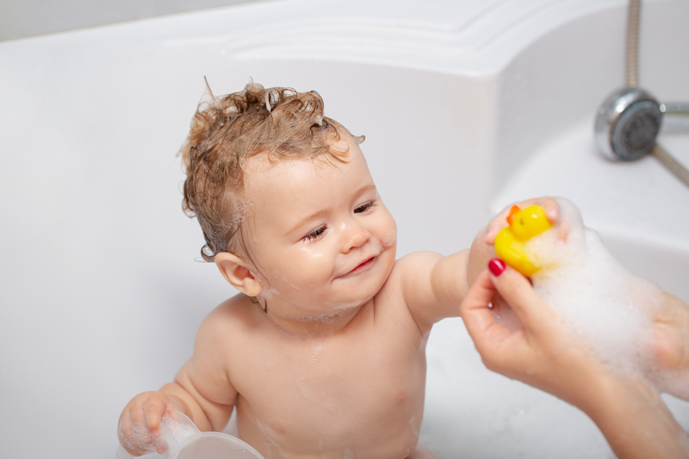 Baby getting a bath a part of a bedtime routine 