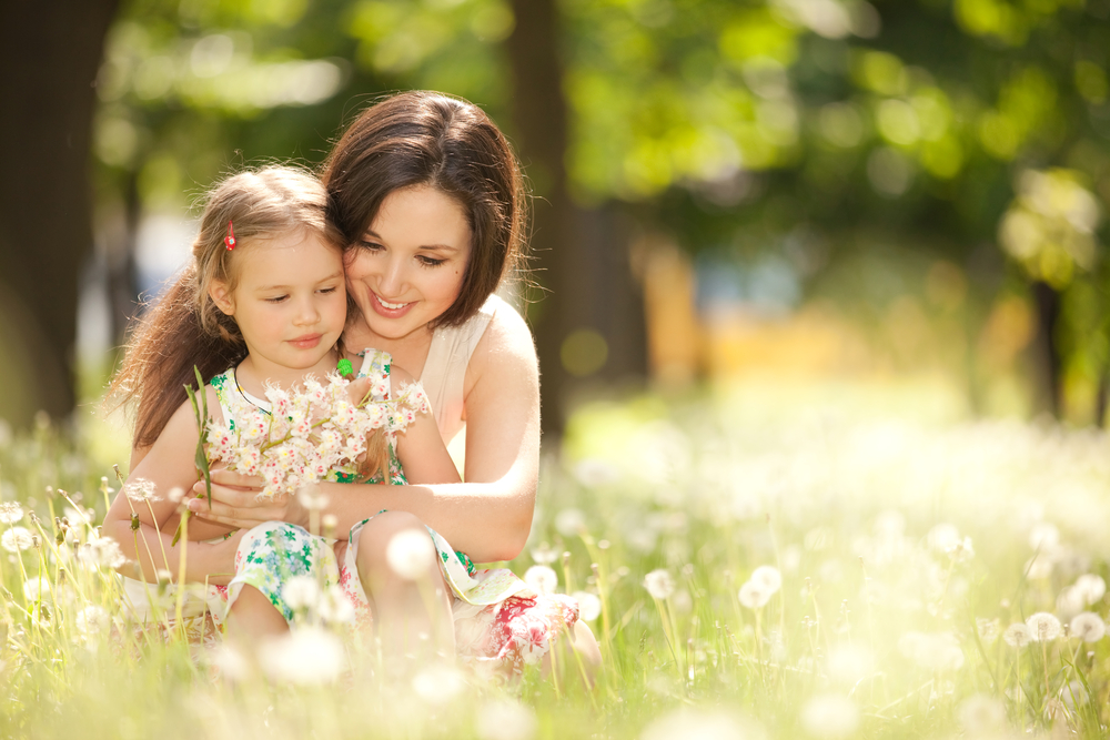 Mom picking flowers with daughter