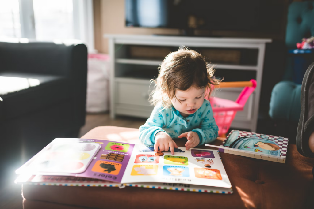 Toddler looking at a picture book