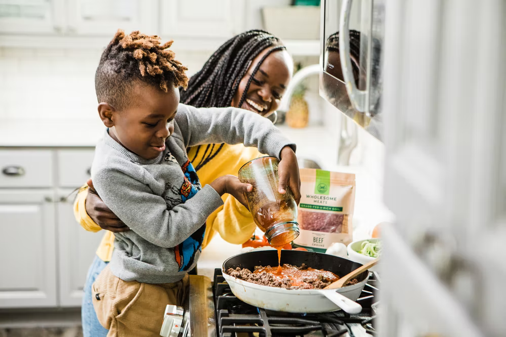 Mom cooking with young son