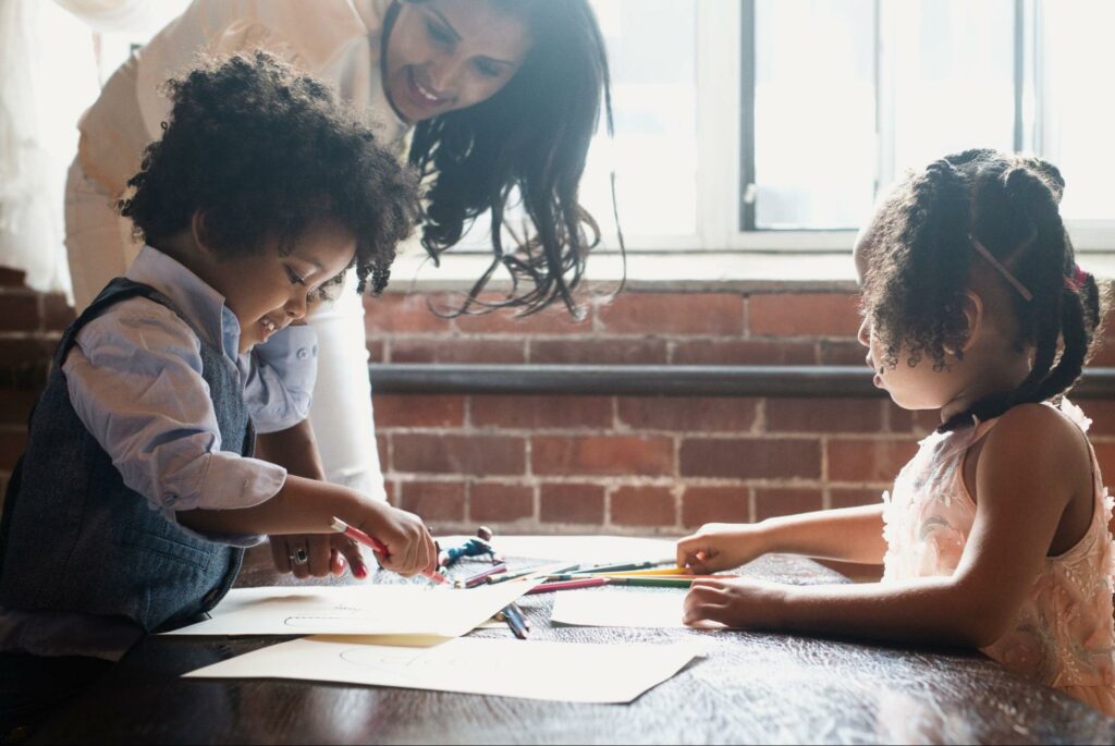 Parent helping kids do learning through play