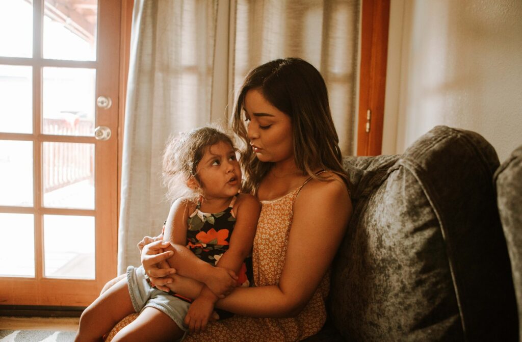 Mom holding daughter