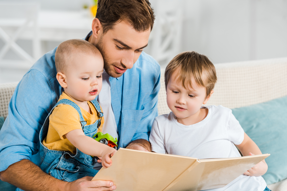 Dad reading to sons