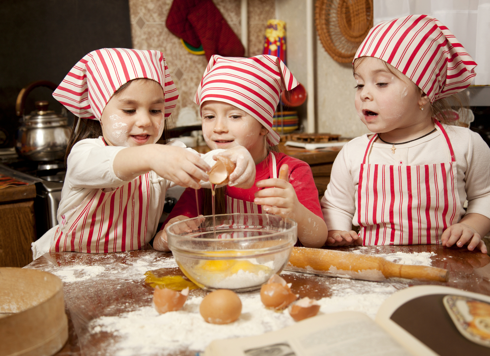 Three kids cooking to learn how to build confidence in kids

