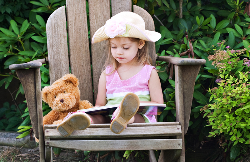 Young girl learning syllables while reading