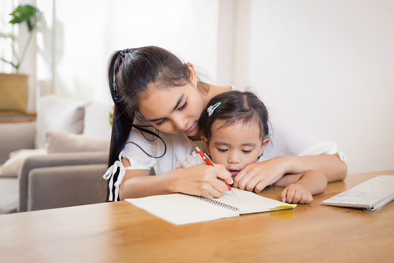 Mom helping child with pre-writing activities