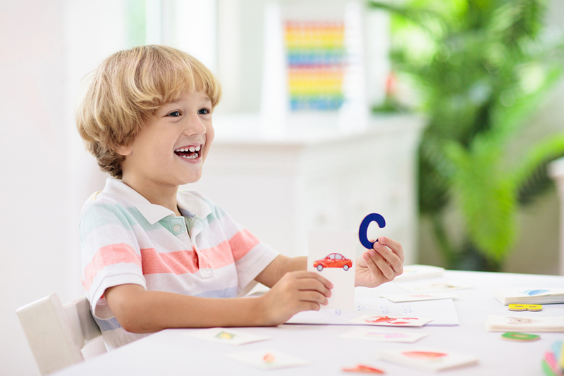 Kid learning Beginning Sound Matching