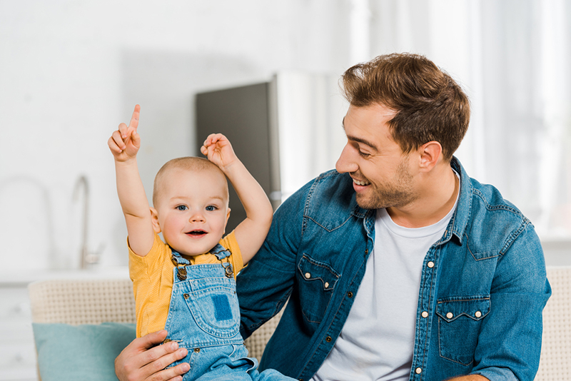 dad playing with young toddler