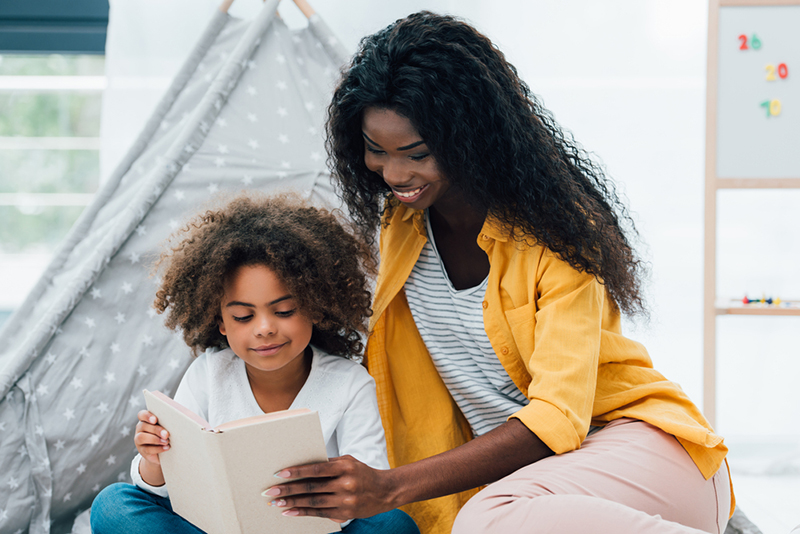 Mom reading with kid