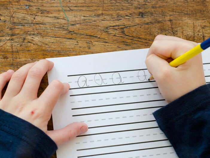 kid practicing letter formation