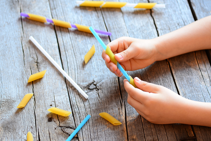 Kid playing a game to help with fine motor skills