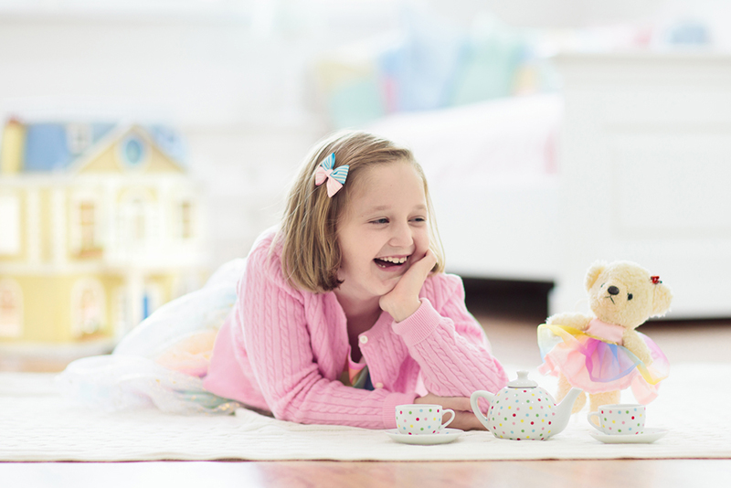 Young girl having a tea party